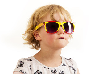 Portrait of a girl with blond hair and sunglasses