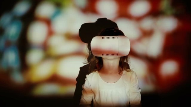Little girl using 3D Virtual Reality headset