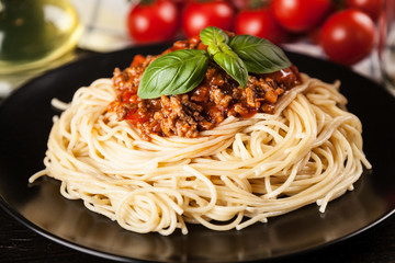Spaghetti bolognese on dark background