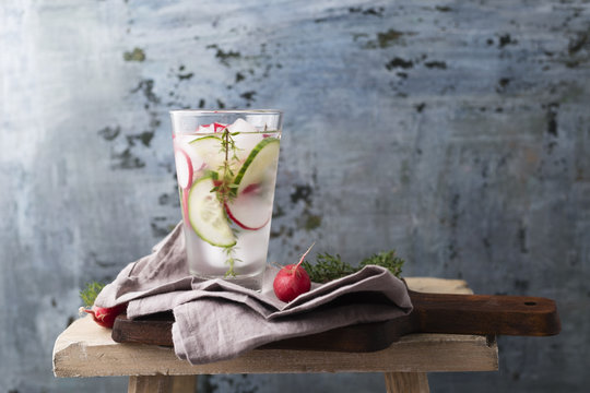 Water with thyme, cucumber and red radish, ice-cooled