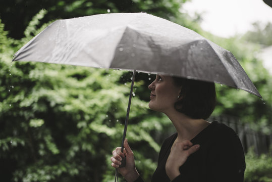 Woman with umbrella on a rainy day