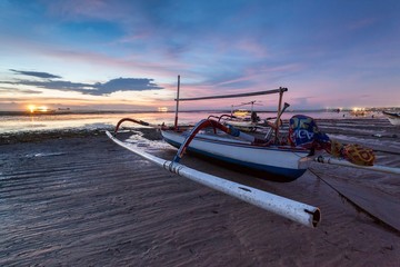 Holiday in Bali, Indonesia - Reflection Sunrise in Tanjong Benoa with boat