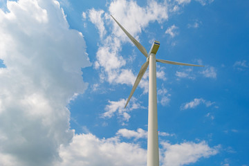 Wind turbine in a sunny sky in summer