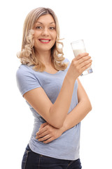 Joyful woman holding a glass of milk
