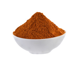Cinnamon powder in white  bowl on white background