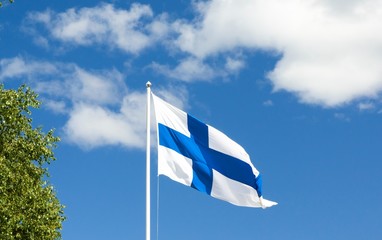 Flag of Finland on sky background.
