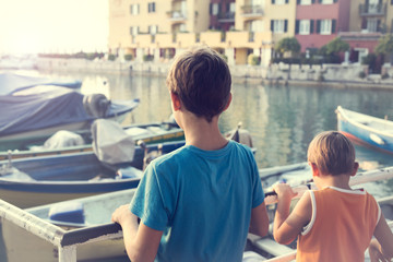  dreamy brothers looking intrigued to seaport
