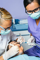 Dentists working with patient
