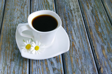 Cup of fresh espresso on rustic wood background
