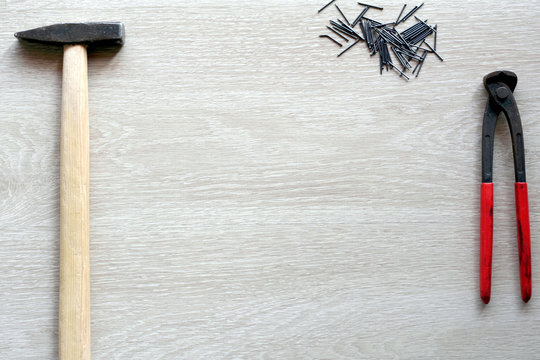 Carpenter tools with wooden background. Top view with copy space
