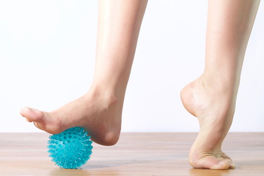 Detail Of Ballet Dancer Feet With  Ball For Massage