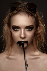 Beauty blonde Woman black Paint from her Mouth