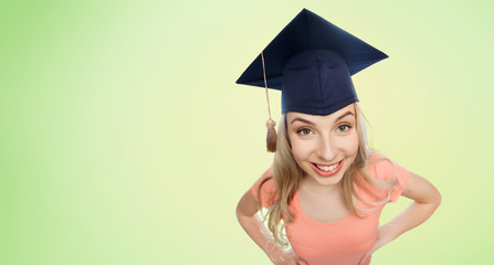 smiling young student woman in mortarboard
