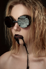 Beauty female Model with black Drips on Face