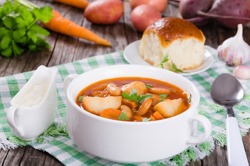 Ukrainian vegetable and meat soup borscht , close-up