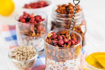 Homemade granola in open glass jar
