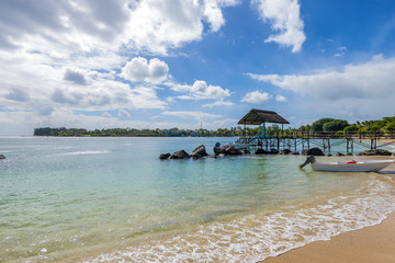 Mauritius beach thatch jetty. Tropical Mauritius island water & beach resort, Turtle Bay - Balaclava