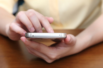 woman playing mobile phone
