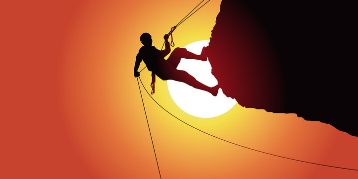 descente en rappel d’un alpiniste après une escalade un rocher en surplomb sous un soleil