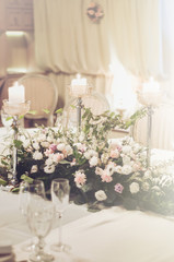 Luxury background wedding celebration wallpaper, floral. Elegance table set in banquet restoraunt with elegant composition of beige roses, peony flowers. Text, copy space.