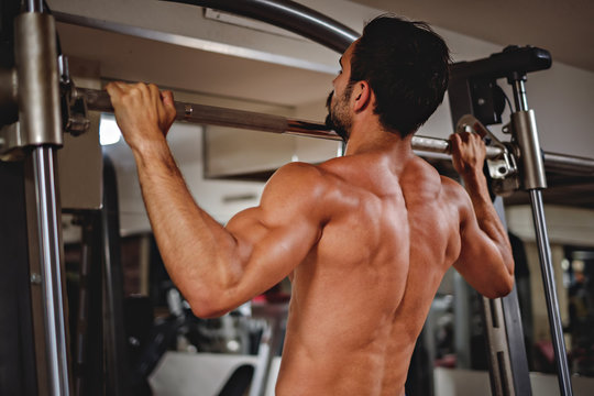 Man doing pull ups on the bar
