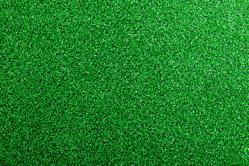 Artificial turf. Studio shot. Green background. Copy space.