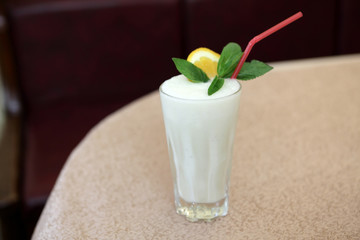 Glass of milkshake in restaurant
