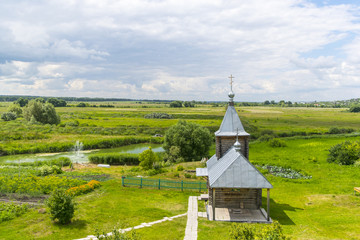 Landscape with the Russian Orthodox Church and cloudy sky. 