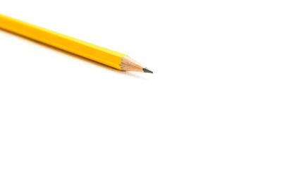 yellow pencil on white background
