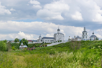 Landscape with the Russian Orthodox Church and cloudy sky. 