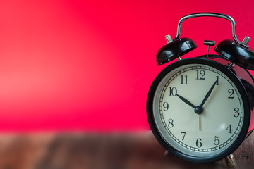 Alarm clock on the floor, vintage tone