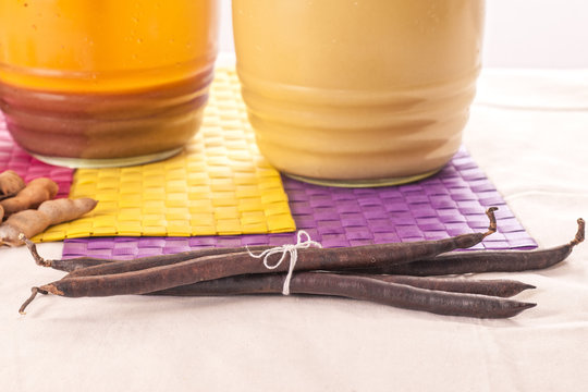 A jug of tamarind and vanilla beverages.