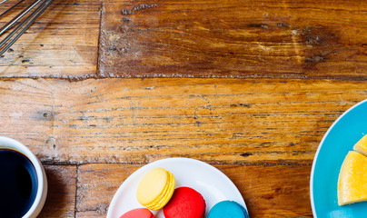 Sweet and colourful french macaroons or macaron on wood table