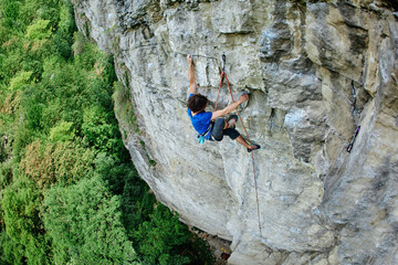 male rock climber. rock climber climbs on a rocky wall
