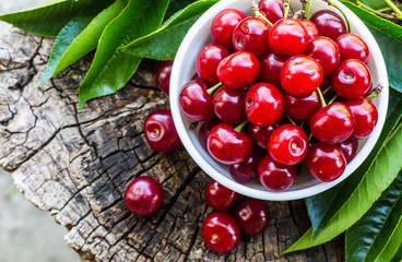 fresh cherries on wooden table