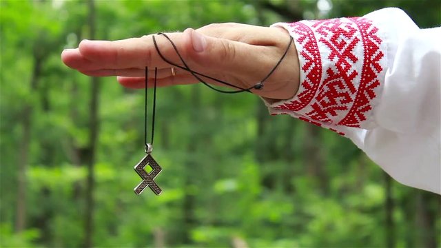 shaman in the hand holding the fire rune