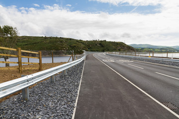 Fototapeta premium Railway and road over new river crossing, Pont Briwet bridge.