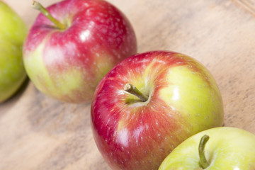 tasty apples on a wooden background
