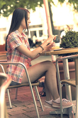 Young woman in Street cafe