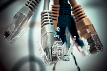 Twisted into a bundle of wire and patch cords. 
