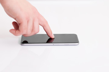 man holding a phone with isolated screen over the desk in the of