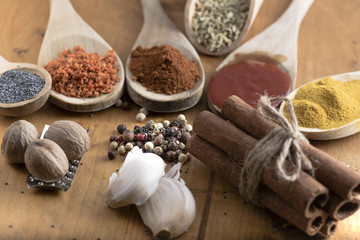 Various colorful spices and food drugs on wooden table