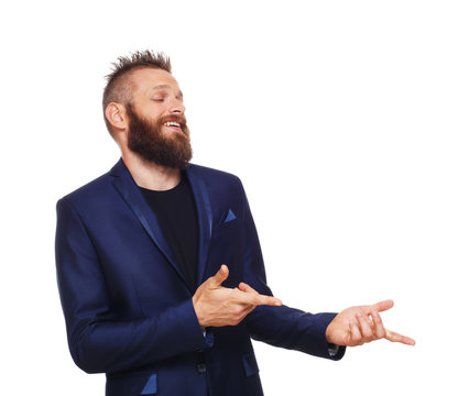 Portrait of young man, laughing, pointing with fingers at something