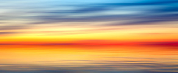 Panele Szklane  Nice bright red yellow blue abstract blur texture background panorama landscape with sunset on lake