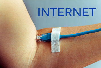 Female hand bent at the elbow. In his hand is the cable for internet, patch cord. On hand glued...