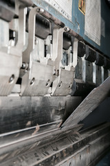 operator bending metal sheet by sheet bending machine