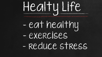 Fototapeta na wymiar Healthy Life concept on Black chalkboard