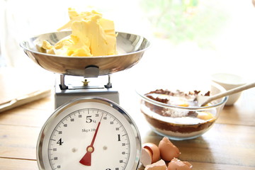 Butter being weighed for a chocolate cake