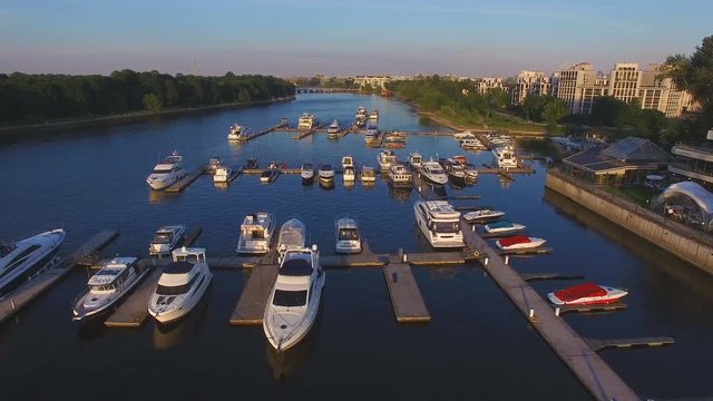 Aerial view of marina full yachts and boats at sunset