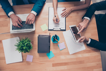 Top view of workstation of businesspeople working with laptop, t